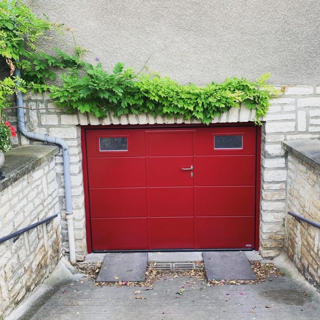 Porte de garage sectionnelle avec portillon Novoferm